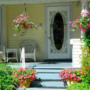 porch of a house decorated with potted plants