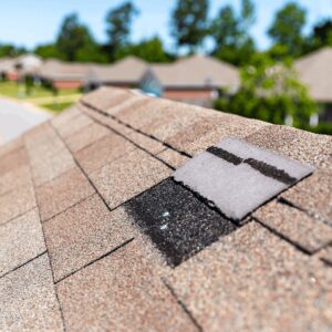 storm damage on an asphalt roof